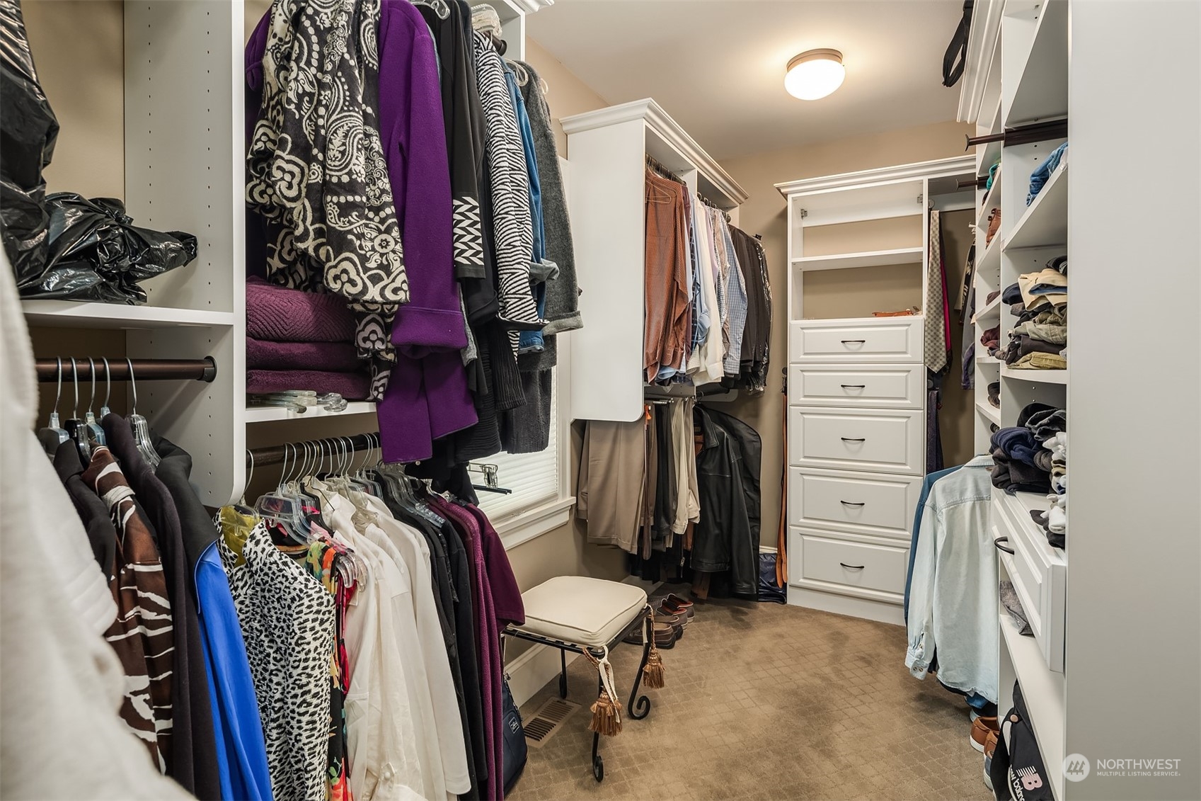 9013 Northeast 190th Street Bothell, WA 98011 - Photo 25 of 39 a view of walk in closet with clothes and shoes