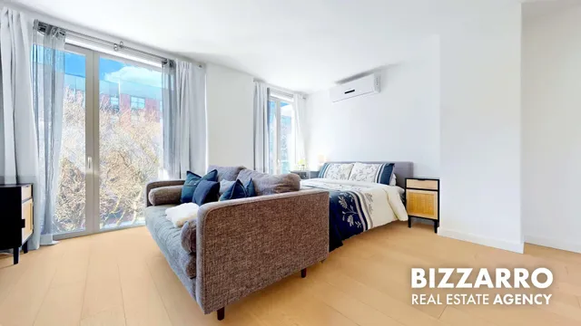 a bed room with a bed and a couch