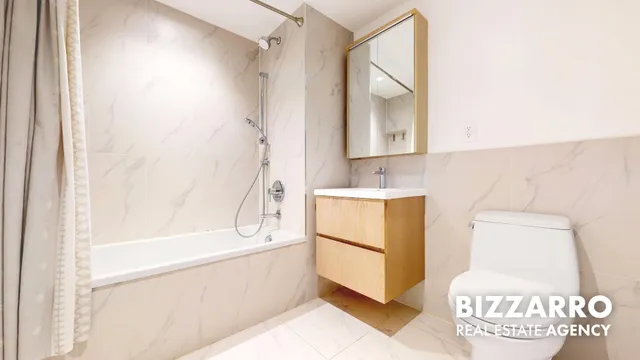 a bathroom with a sink a toilet and bathtub