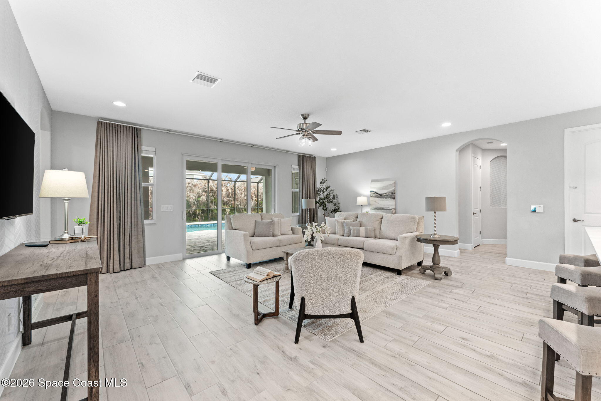3158 Addison Drive Melbourne, FL 32940 - Photo 13 of 51 a living room with furniture and a wooden floor