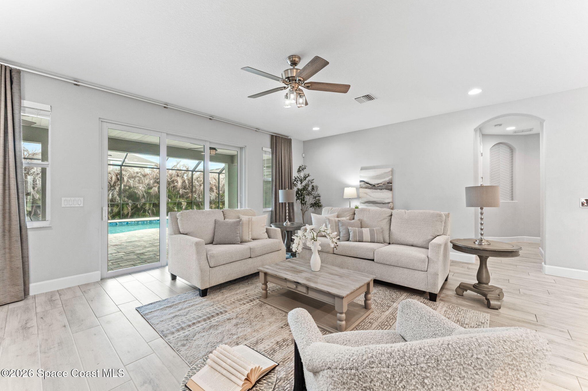 3158 Addison Drive Melbourne, FL 32940 - Photo 14 of 51 a living room with furniture and a large window