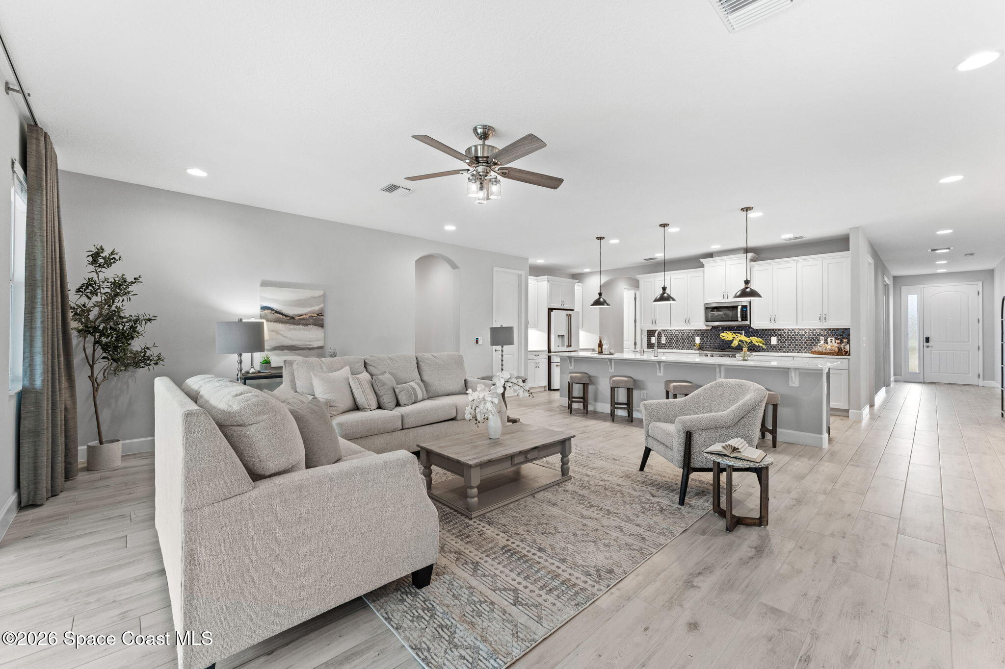 3158 Addison Drive Melbourne, FL 32940 - Photo 15 of 51 a living room with furniture and kitchen view