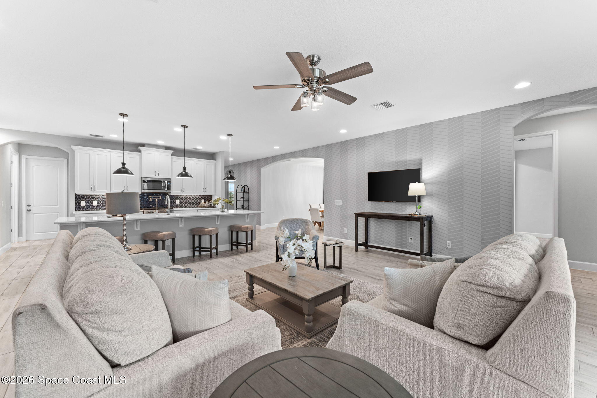 3158 Addison Drive Melbourne, FL 32940 - Photo 16 of 51 a living room with furniture and a view of kitchen