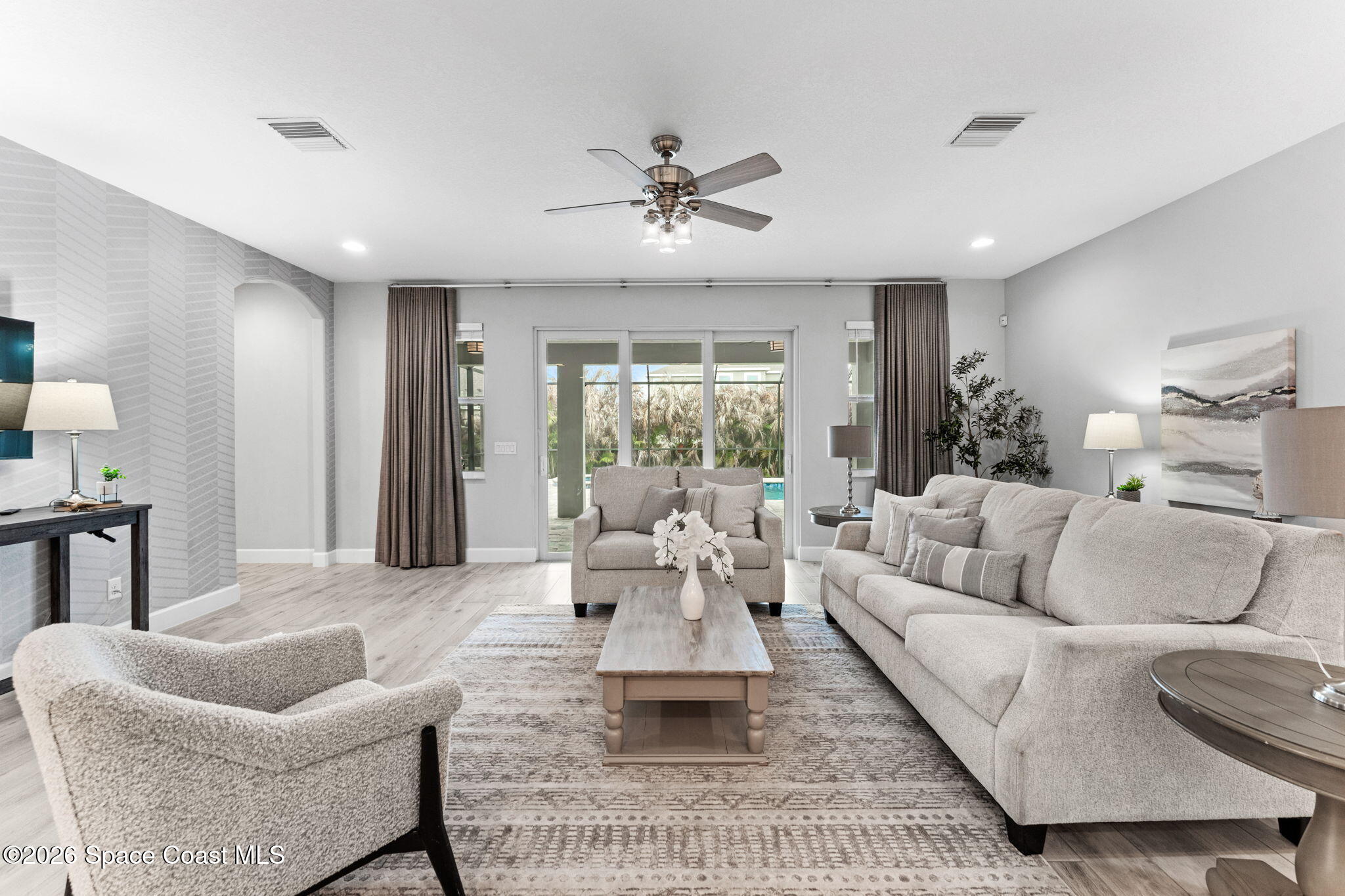 3158 Addison Drive Melbourne, FL 32940 - Photo 18 of 51 a living room with furniture and a large window