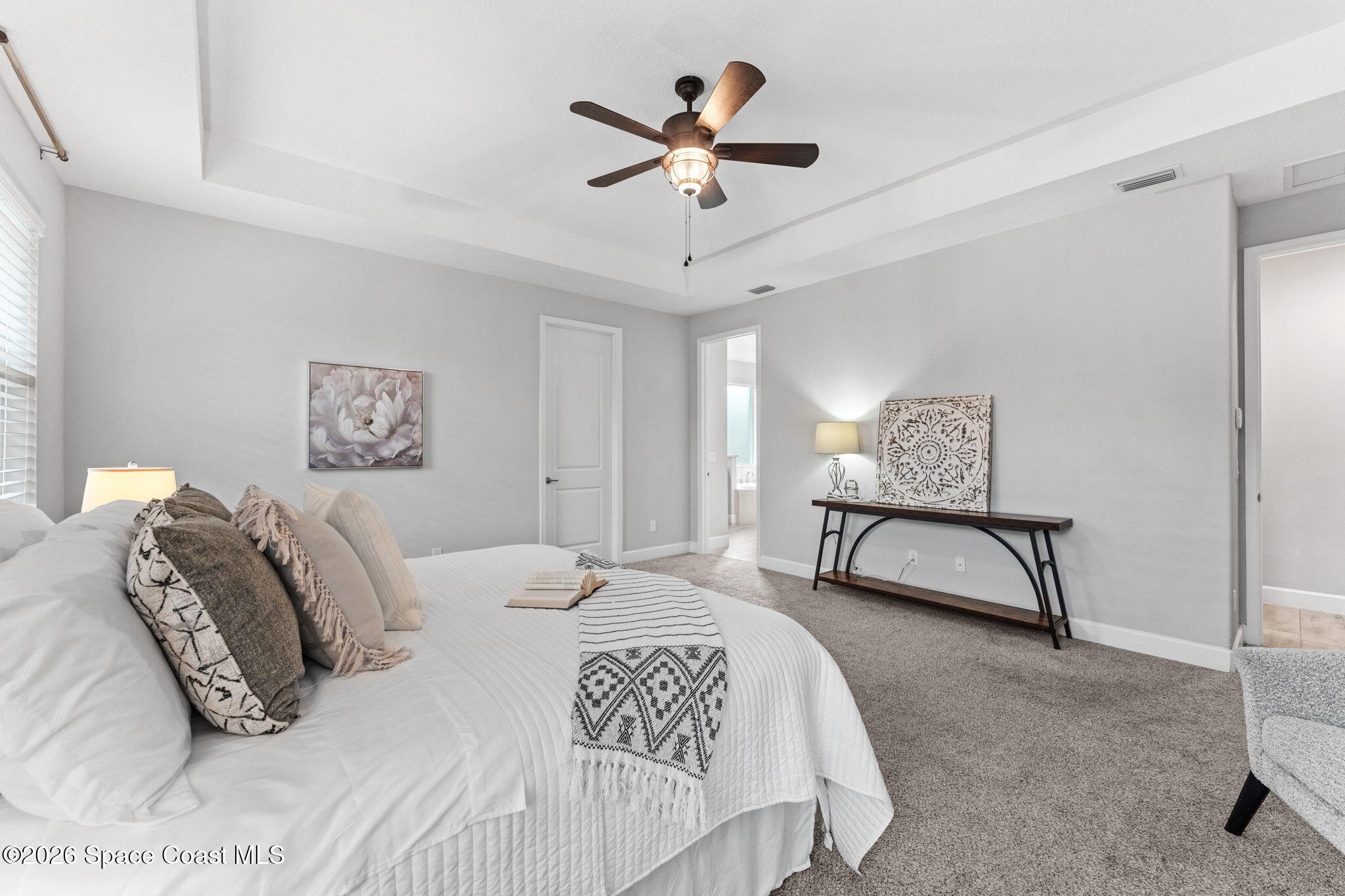 3158 Addison Drive Melbourne, FL 32940 - Photo 20 of 51 a bedroom with a bed and a potted plant