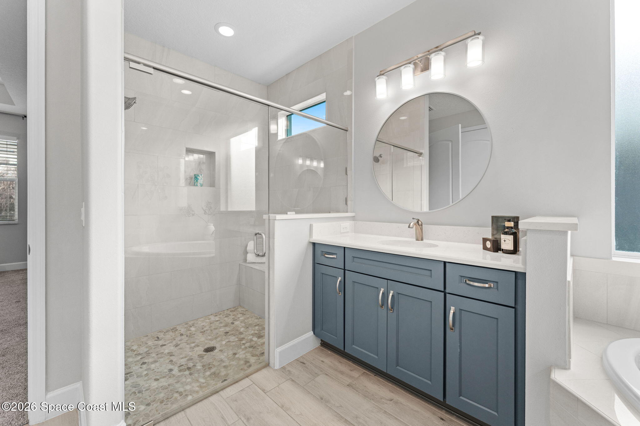 3158 Addison Drive Melbourne, FL 32940 - Photo 24 of 51 a bathroom with a double vanity sink mirror and shower