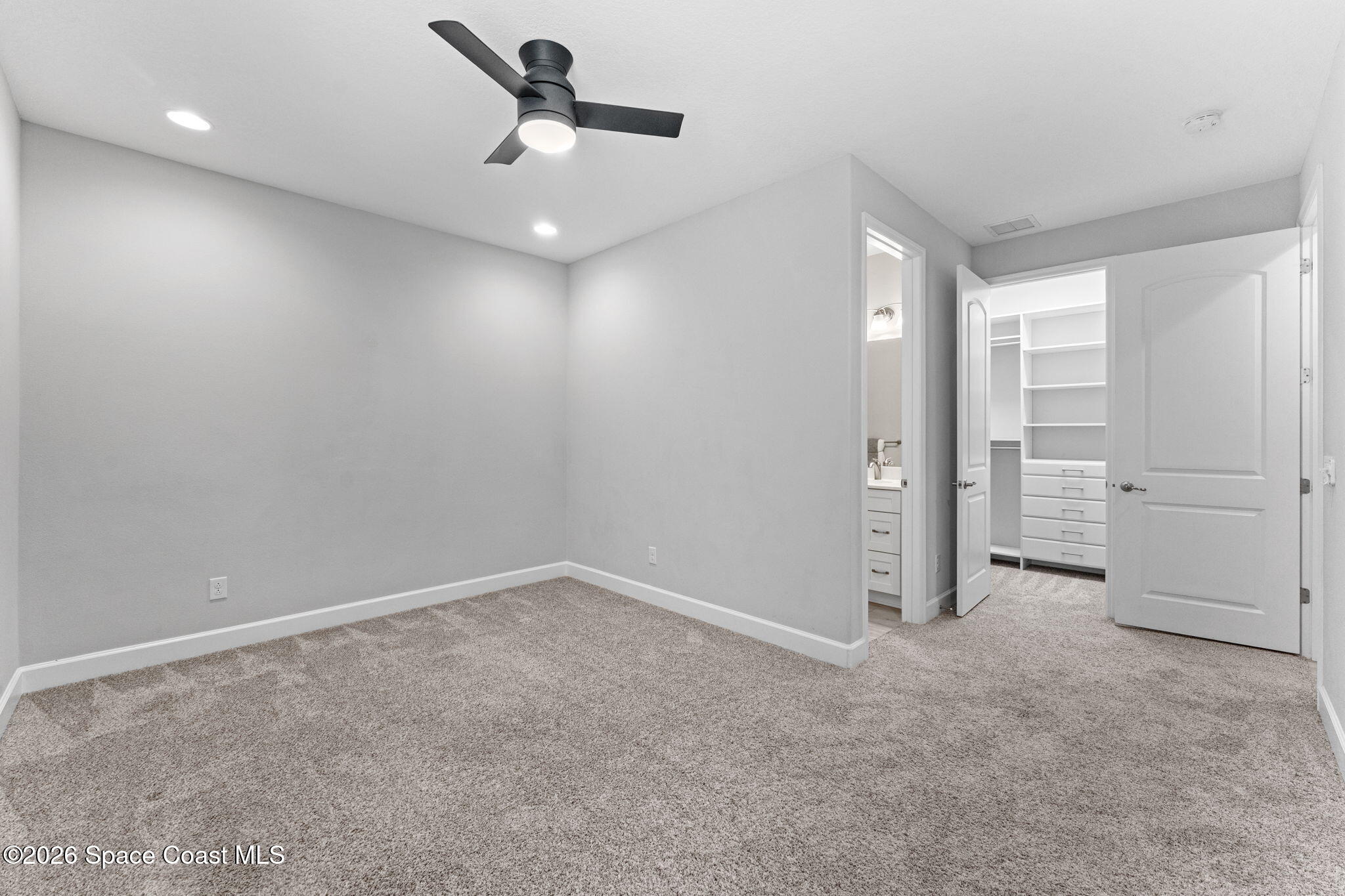 3158 Addison Drive Melbourne, FL 32940 - Photo 26 of 51 an empty room with closet and windows