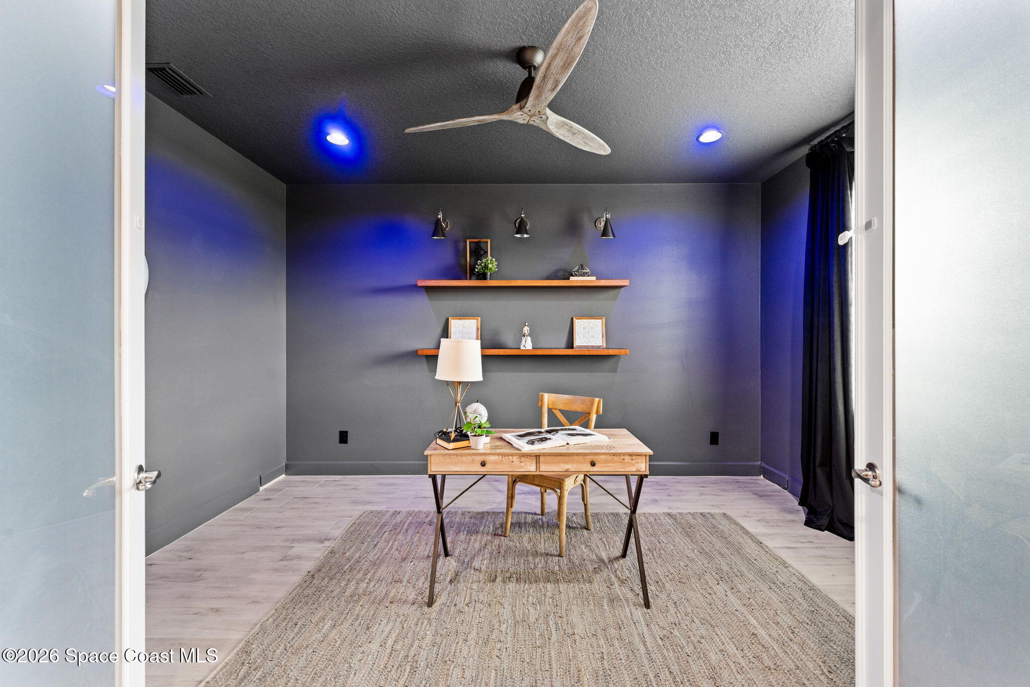 3158 Addison Drive Melbourne, FL 32940 - Photo 33 of 51 a workspace with furniture and wooden floor