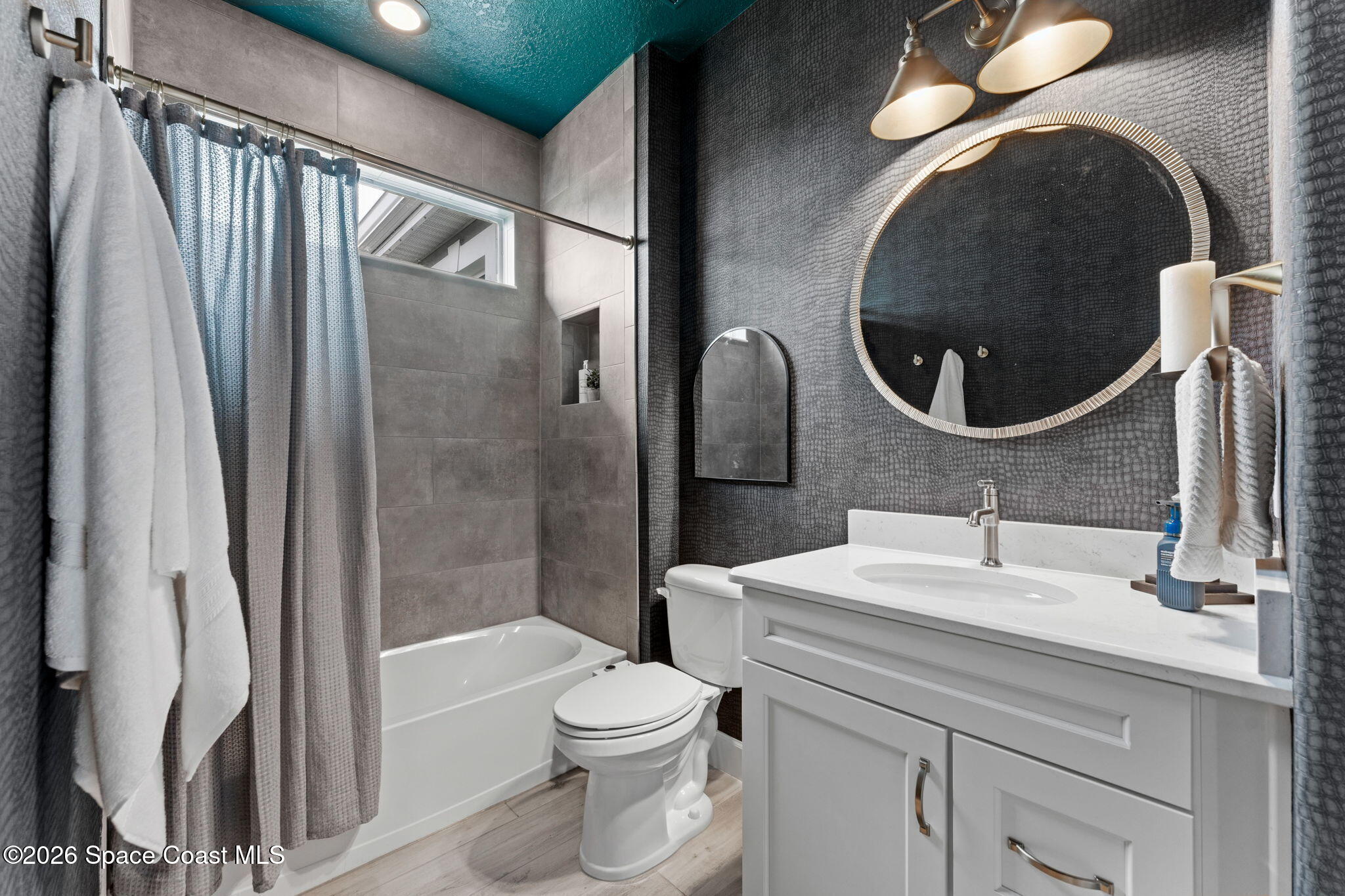 3158 Addison Drive Melbourne, FL 32940 - Photo 37 of 51 a bathroom with a sink a toilet and shower