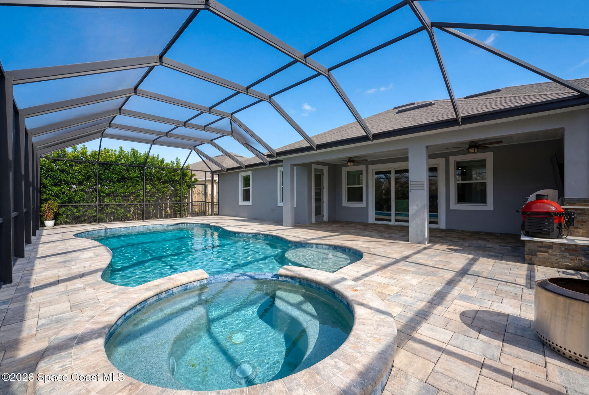 3158 Addison Drive Melbourne, FL 32940 - Photo 46 of 51 a view of a house with backyard sitting area and tub