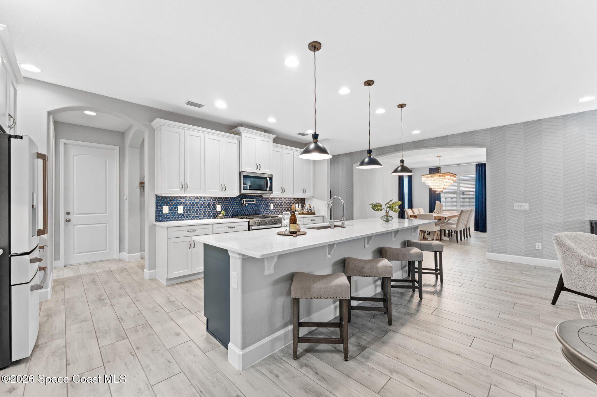 3158 Addison Drive Melbourne, FL 32940 - Photo 8 of 51 a large kitchen with cabinets