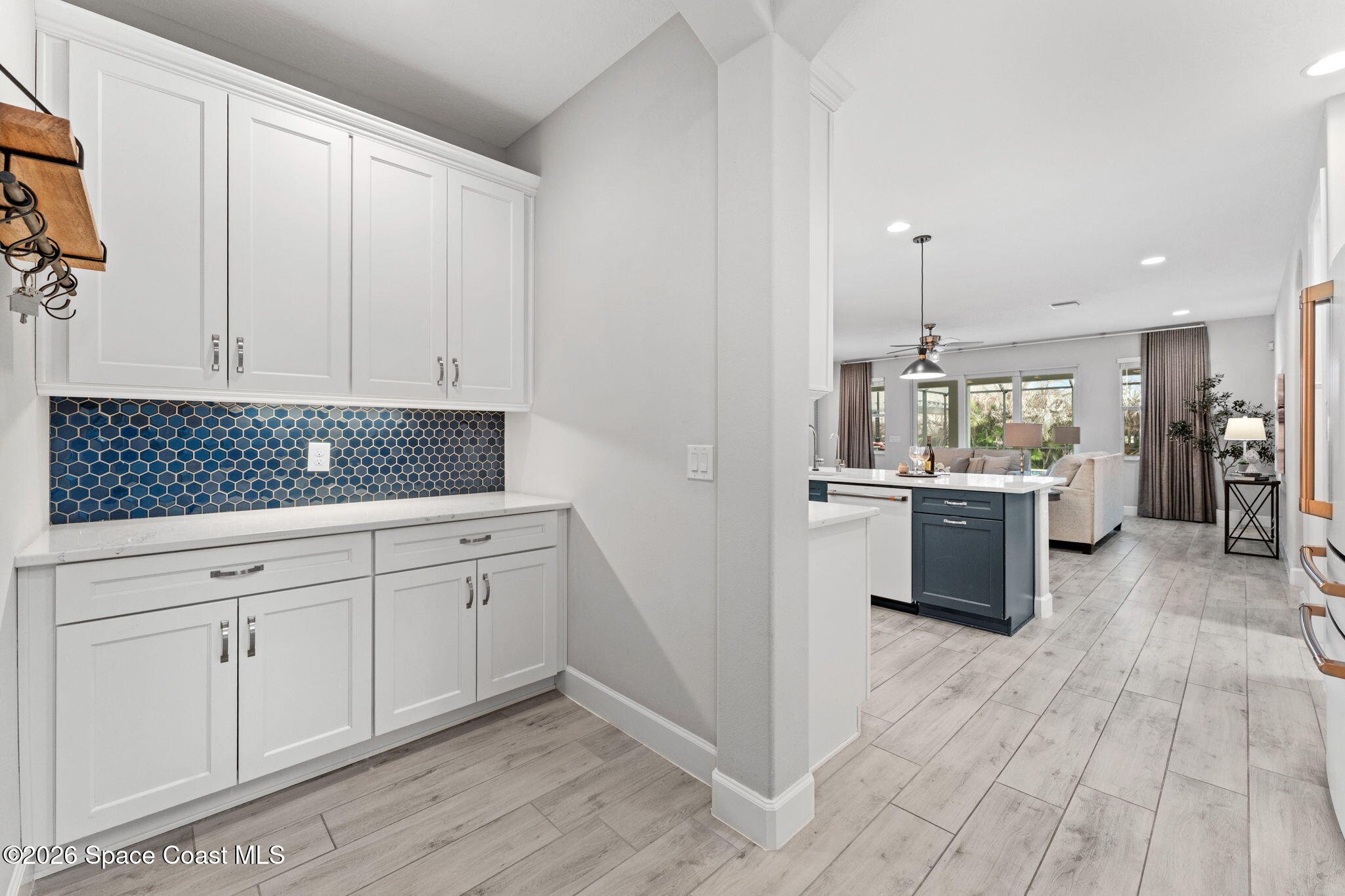 3158 Addison Drive Melbourne, FL 32940 - Photo 9 of 51 a kitchen with stainless steel appliances kitchen island granite countertop a sink and cabinets