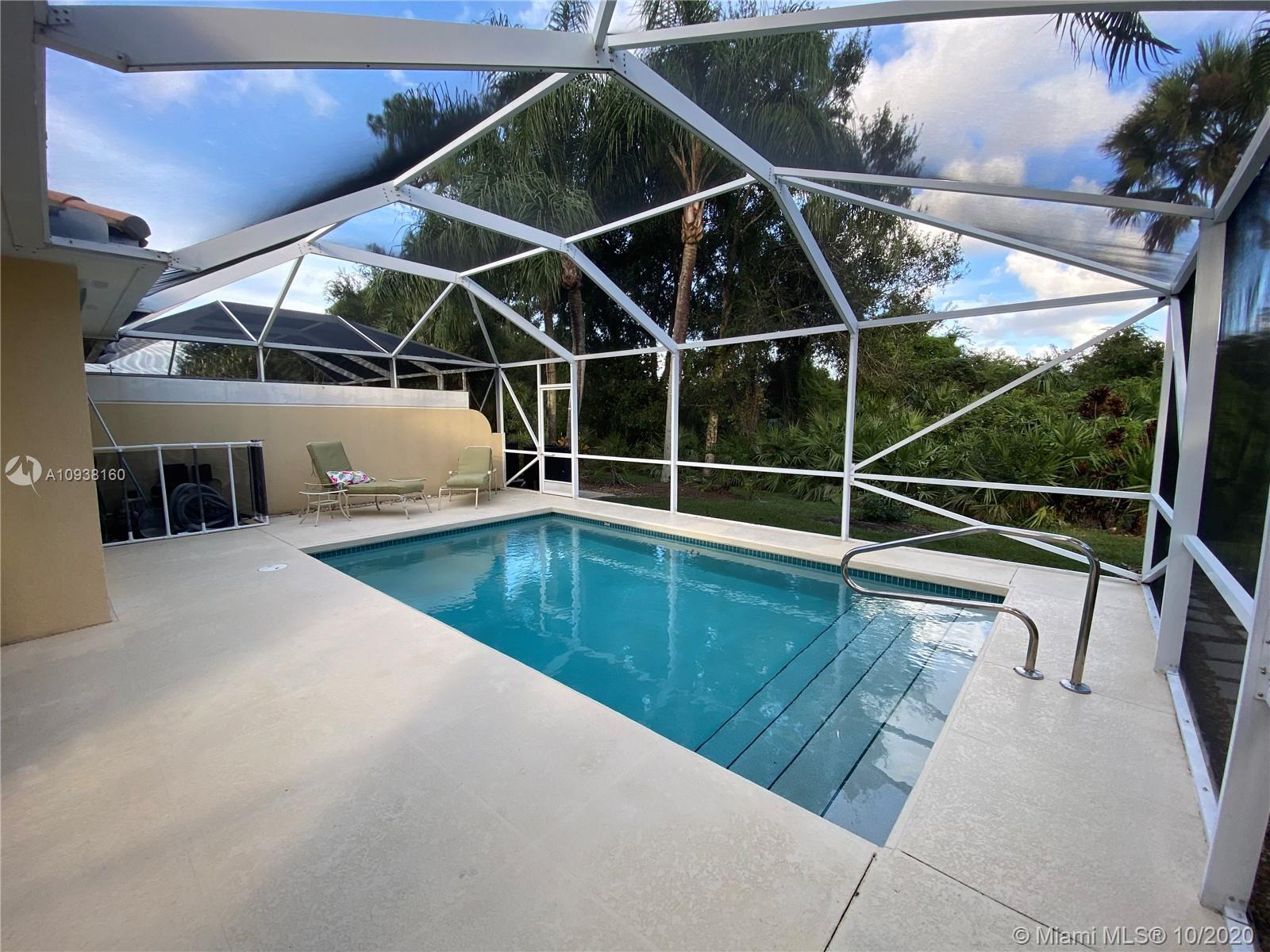 882 Southwest Balmoral Trace Stuart, FL 34997 - Photo 14 of 17 View from patio of pool with tropical preserve