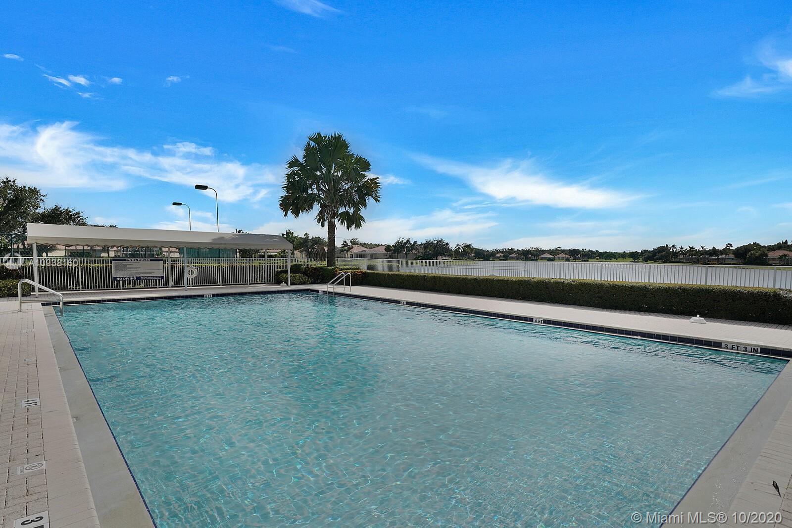 882 Southwest Balmoral Trace Stuart, FL 34997 - Photo 16 of 17 Large community pool with view of lake. Great sunsets!