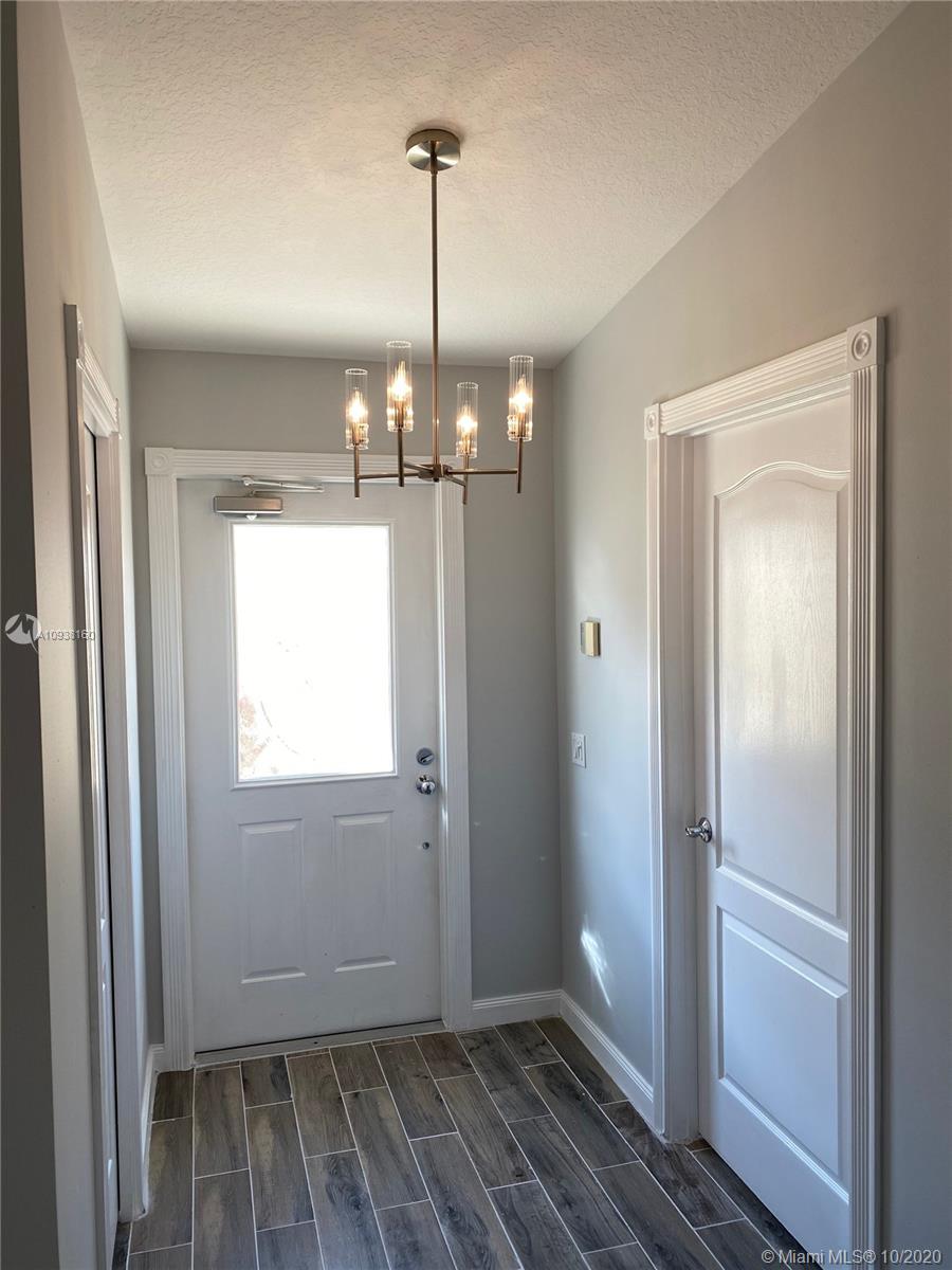 882 Southwest Balmoral Trace Stuart, FL 34997 - Photo 3 of 17 Main entrance