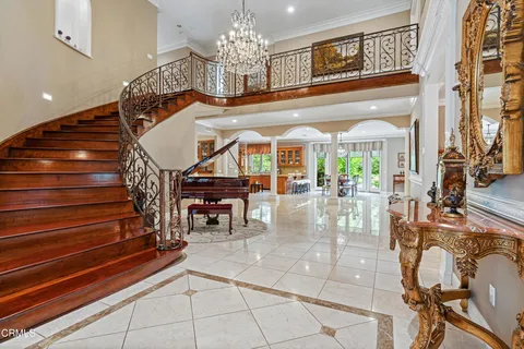 a view of entryway livingroom and hall with wooden floor