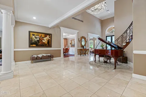 a view of a livingroom with furniture and a flat screen tv