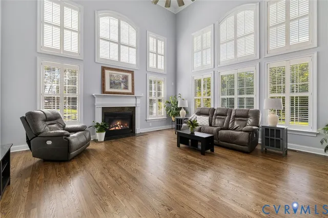 a kitchen with stainless steel appliances kitchen island granite countertop a refrigerator a stove top oven a sink and dishwasher