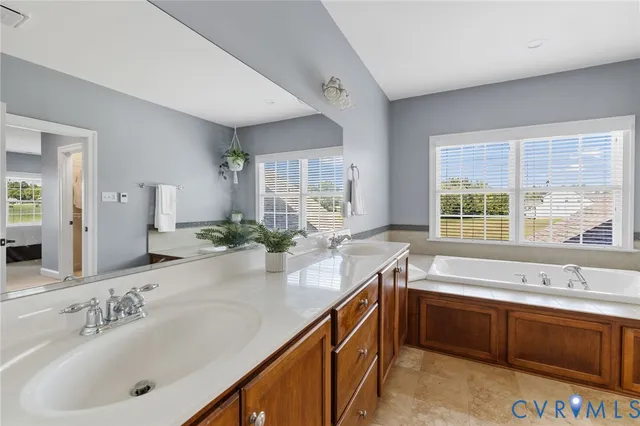 a bathroom with a sink toilet and a mirror