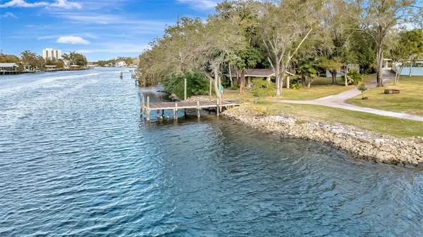 an aerial view of a house with a lake view