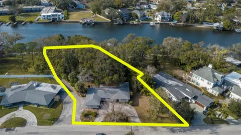 a view of yard with swimming pool and trees