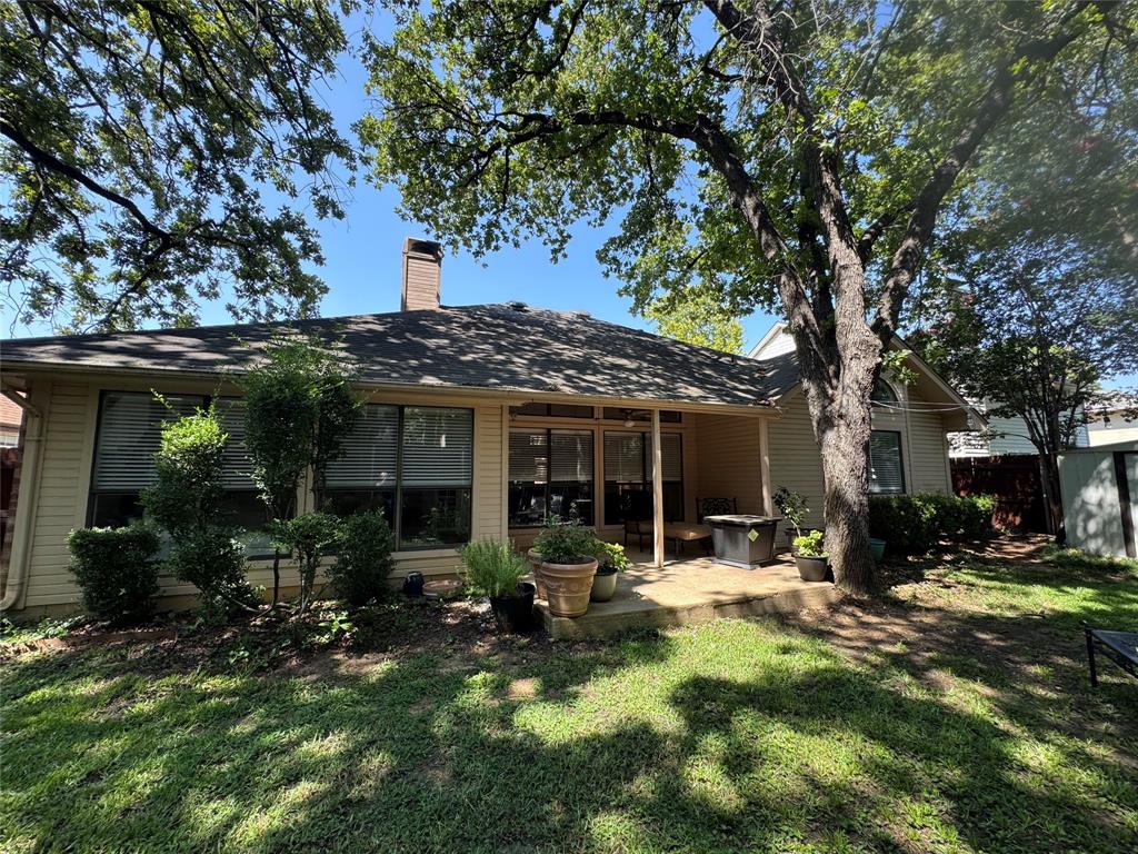521 Post Oak Road Grapevine, TX 76051 - Photo 3 of 16 Charming single-story home with a covered rear patio, mature shade trees, and a level lawn