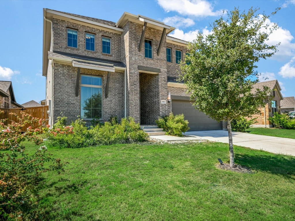 front view of a house with a yard