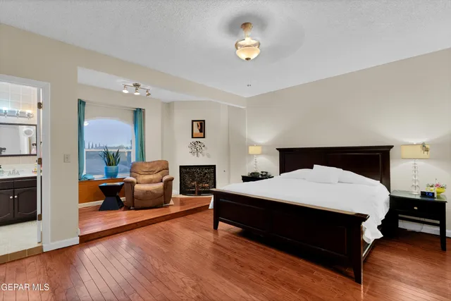 a bed room with a bed and a night stand