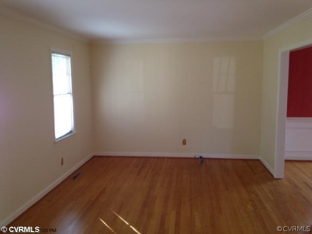 13512 Castleway Road Midlothian, VA 23114 - Photo 5 of 11 an empty room with wooden floor and windows