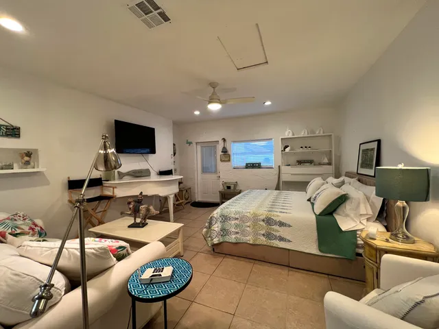 an aerial view of a house with a yard and plants