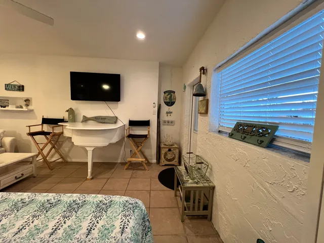 an aerial view of residential houses with outdoor space and street view