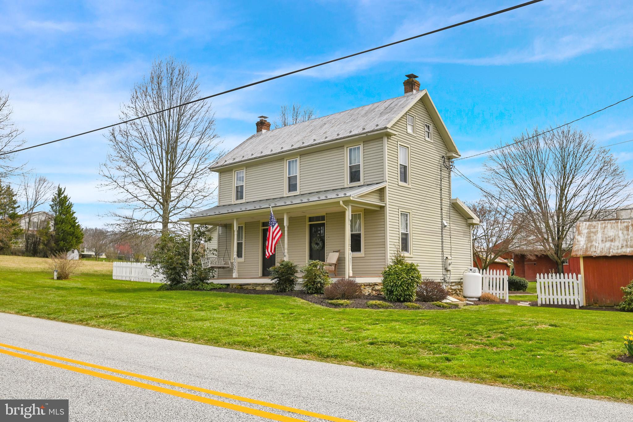 4207 Beckleysville Road Hampstead, MD 21074 - Photo 51 of 68 a view of a white house with a big yard and potted plants