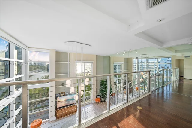 a view of front door with wooden floor