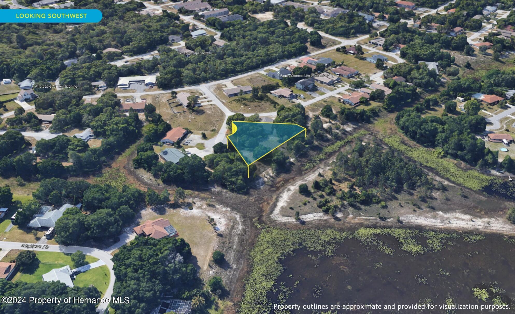 7226 Sky Court Spring Hill, FL 34606 - Photo 12 of 14 an aerial view of a house with a yard