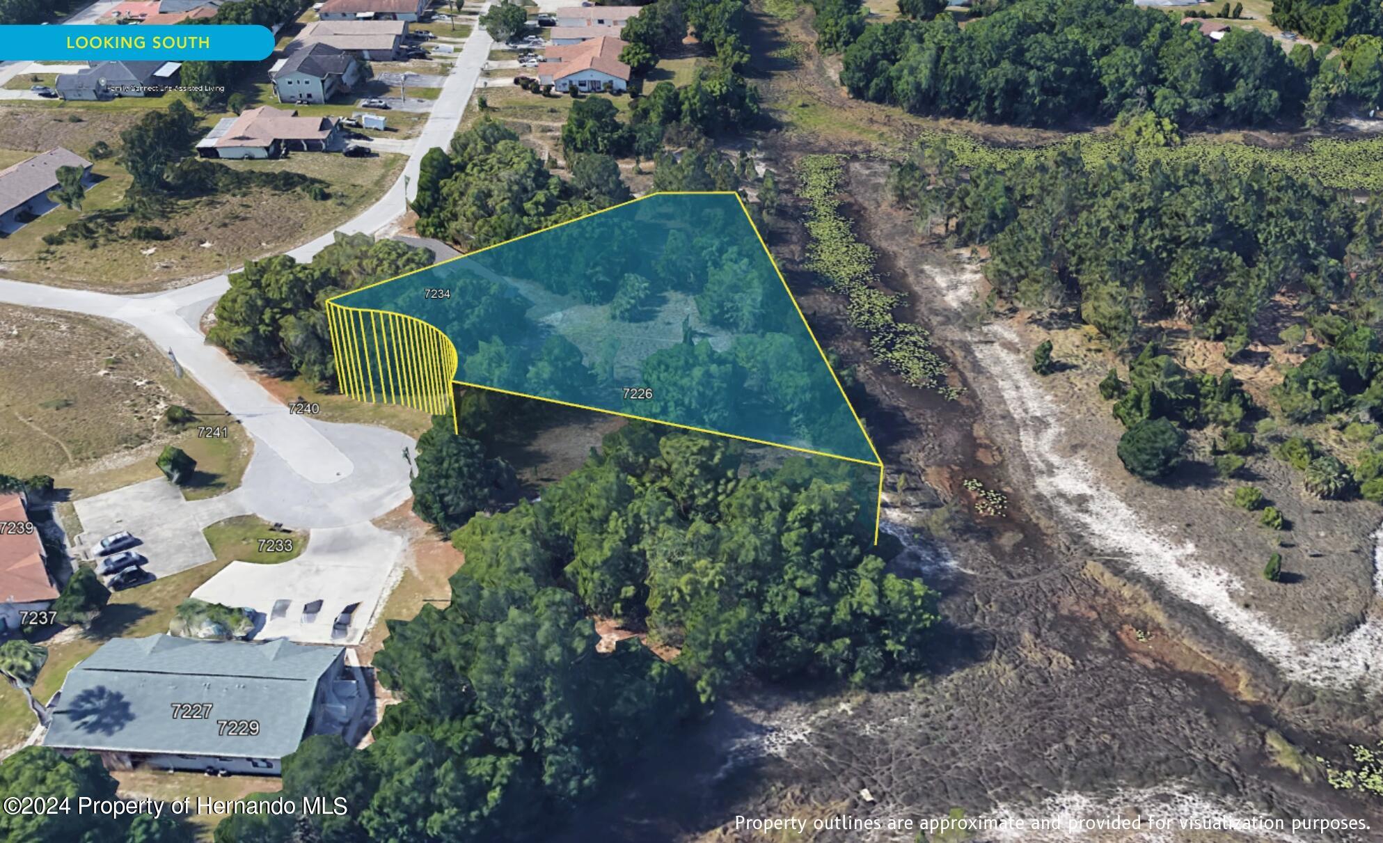 7226 Sky Court Spring Hill, FL 34606 - Photo 13 of 14 an aerial view of a house with a yard