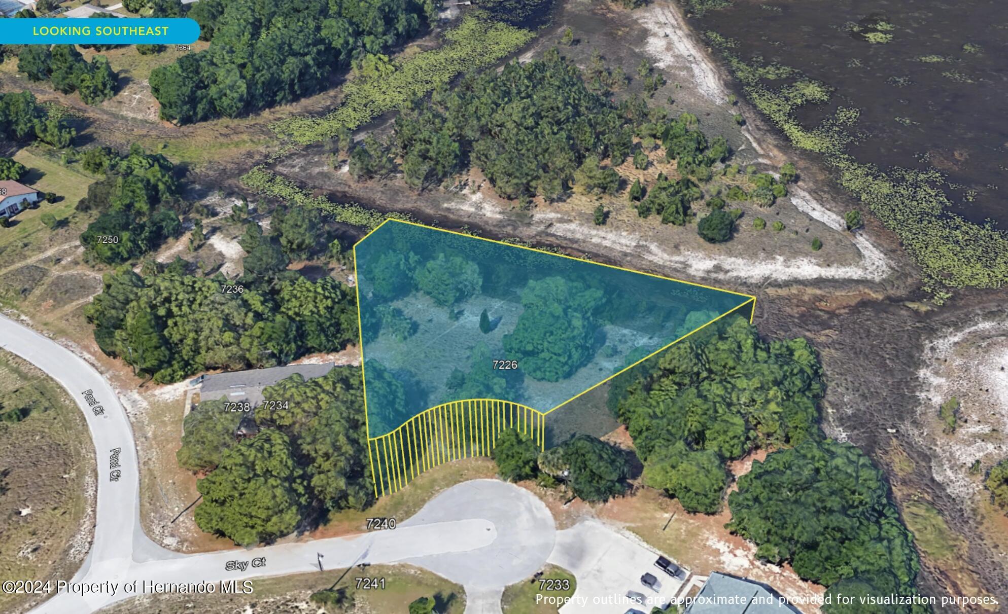 7226 Sky Court Spring Hill, FL 34606 - Photo 14 of 14 an aerial view of a house having yard