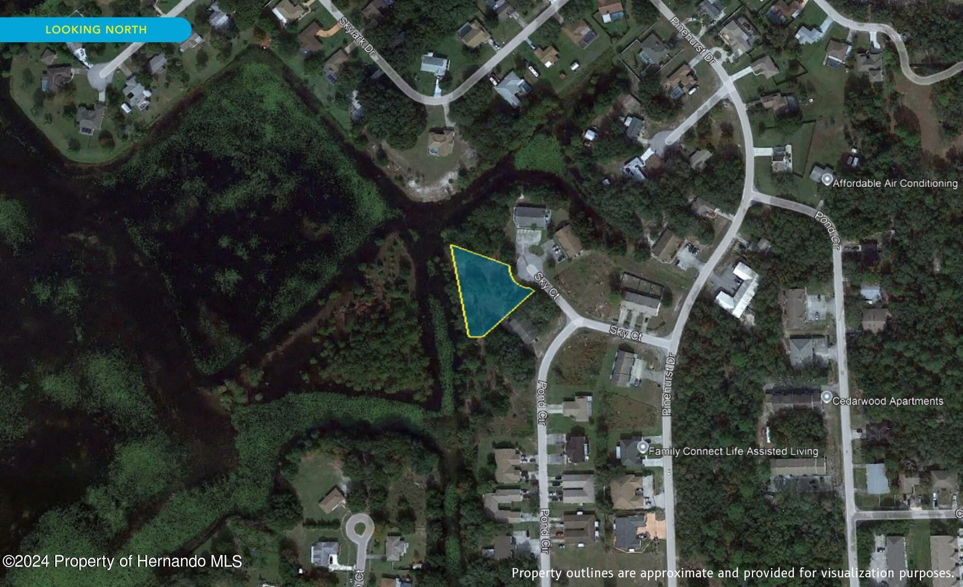 7226 Sky Court Spring Hill, FL 34606 - Photo 5 of 14 an aerial view of a house