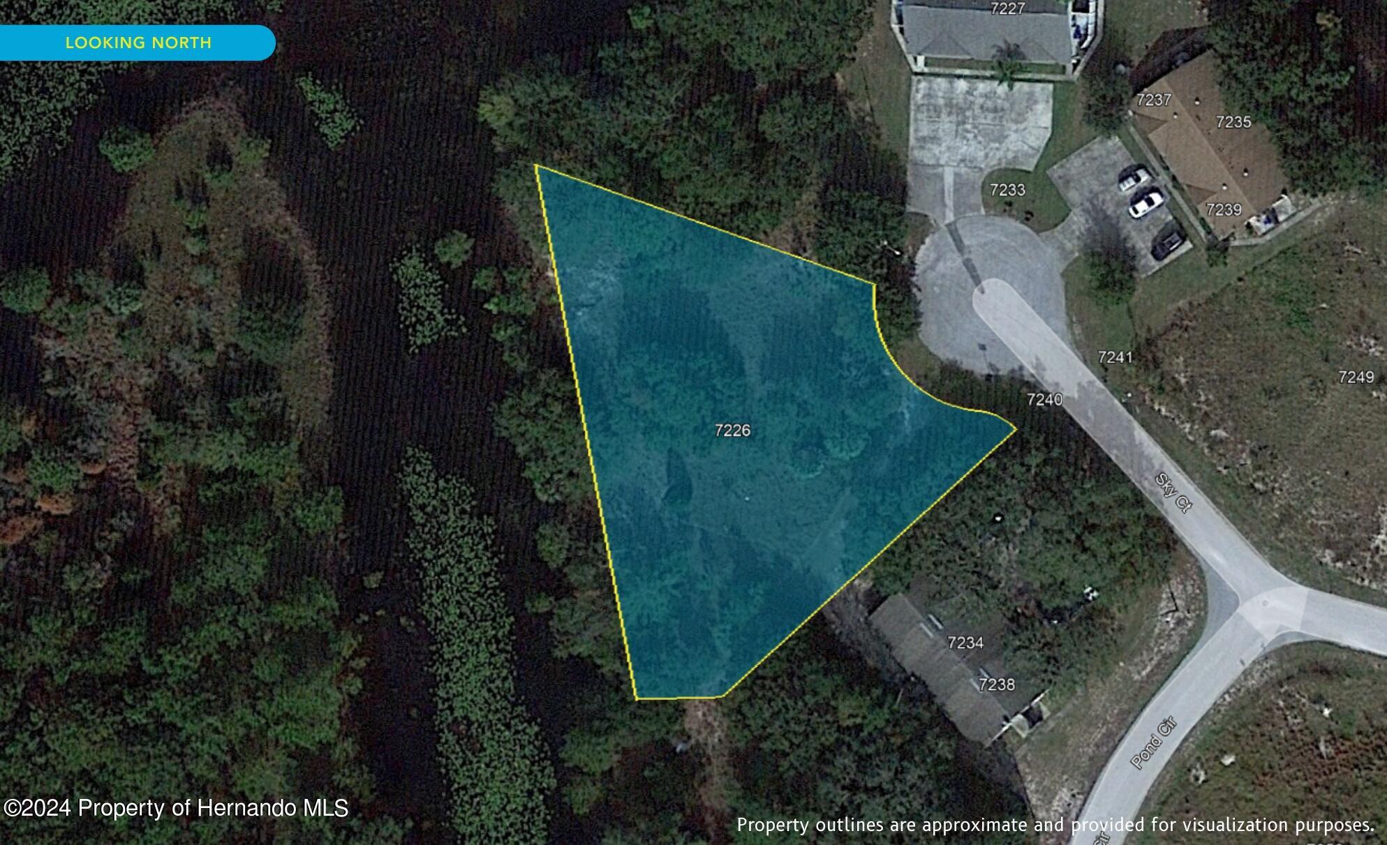 7226 Sky Court Spring Hill, FL 34606 - Photo 6 of 14 an aerial view of a house