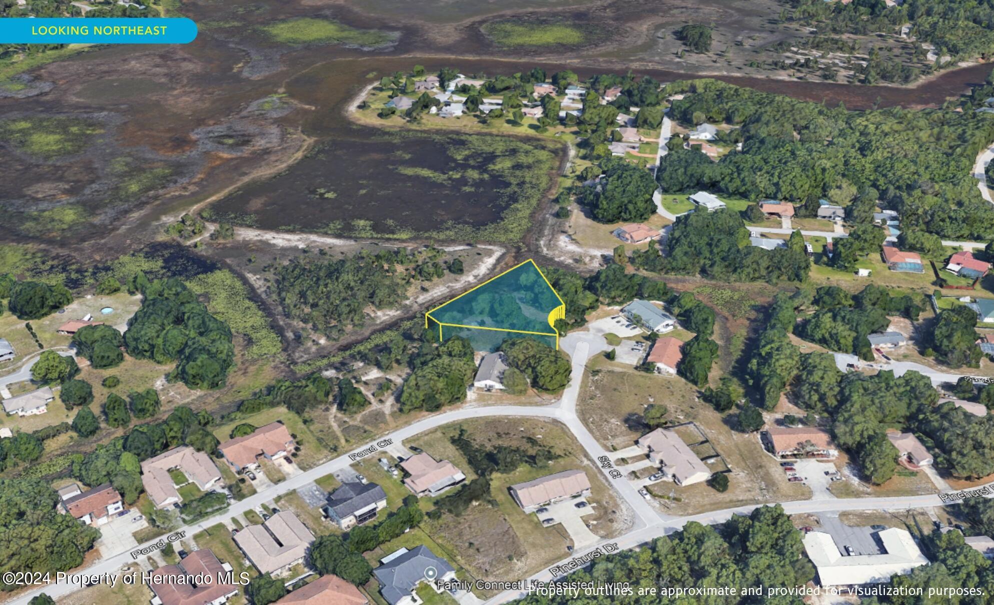 7226 Sky Court Spring Hill, FL 34606 - Photo 7 of 14 an aerial view of a house with a yard