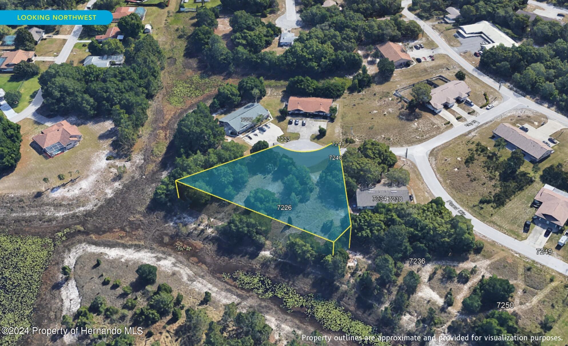 7226 Sky Court Spring Hill, FL 34606 - Photo 10 of 14 an aerial view of a house with a yard