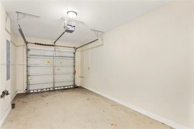 a view of a room with wooden floor and a window