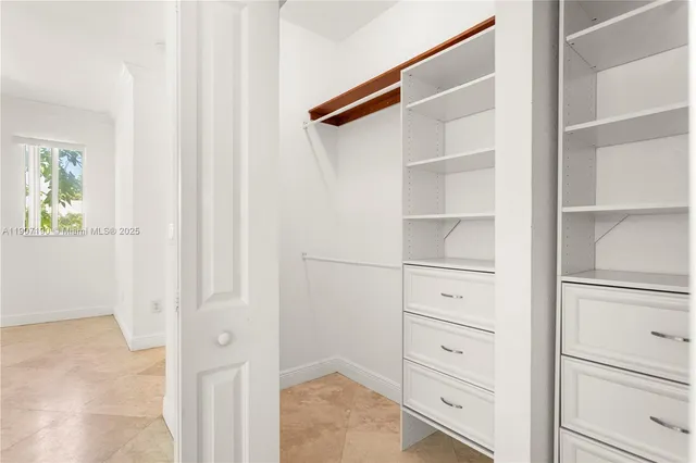 a bathroom with a tub sink and shower