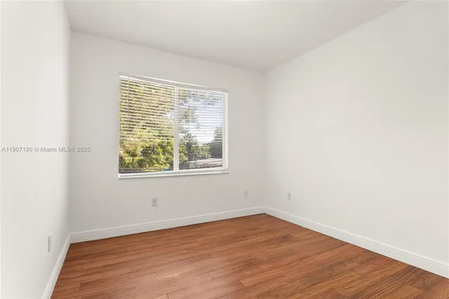 a view of a livingroom with wooden floor