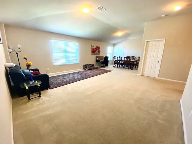 a bed room with furniture and a window