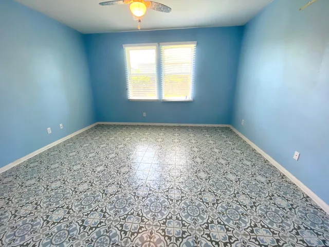 an empty room with a empty space and window