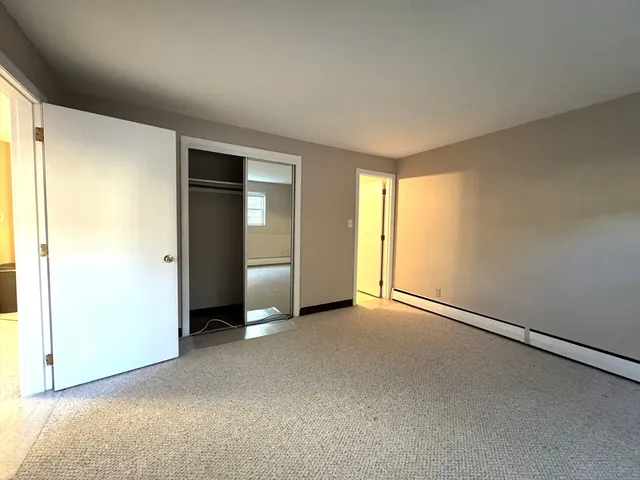 an empty room with closet area