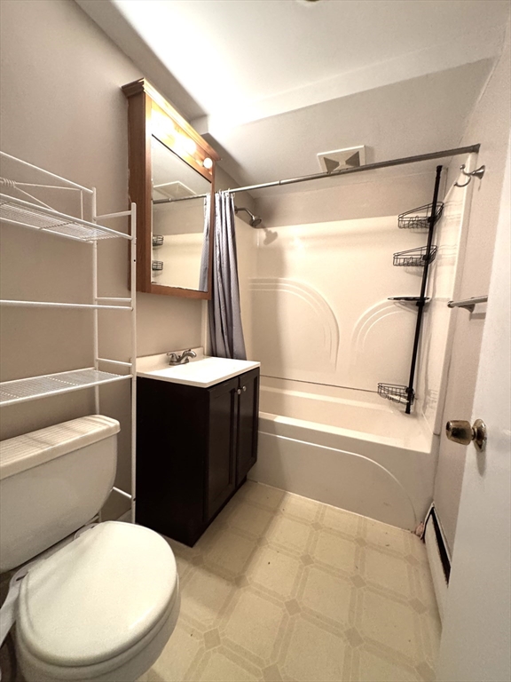 29 Arlington Road, Unit 2 Woburn, MA 01801 - Photo 9 of 11 a bathroom with a sink a toilet and shower