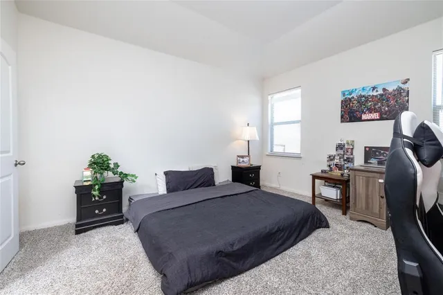 a view of a workspace with furniture and a potted plant