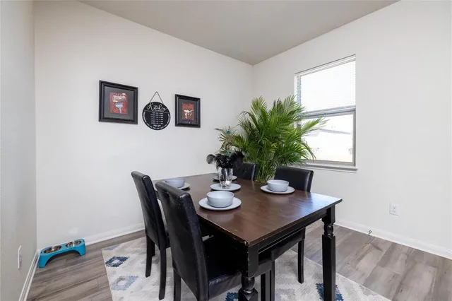 a kitchen with stainless steel appliances granite countertop a stove a microwave a sink and cabinets