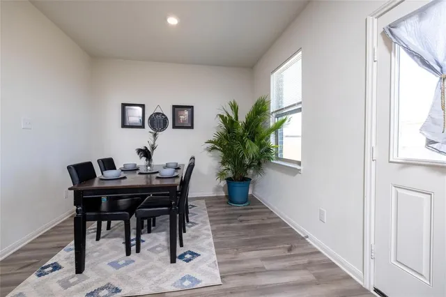 a kitchen with stainless steel appliances granite countertop a stove microwave and sink